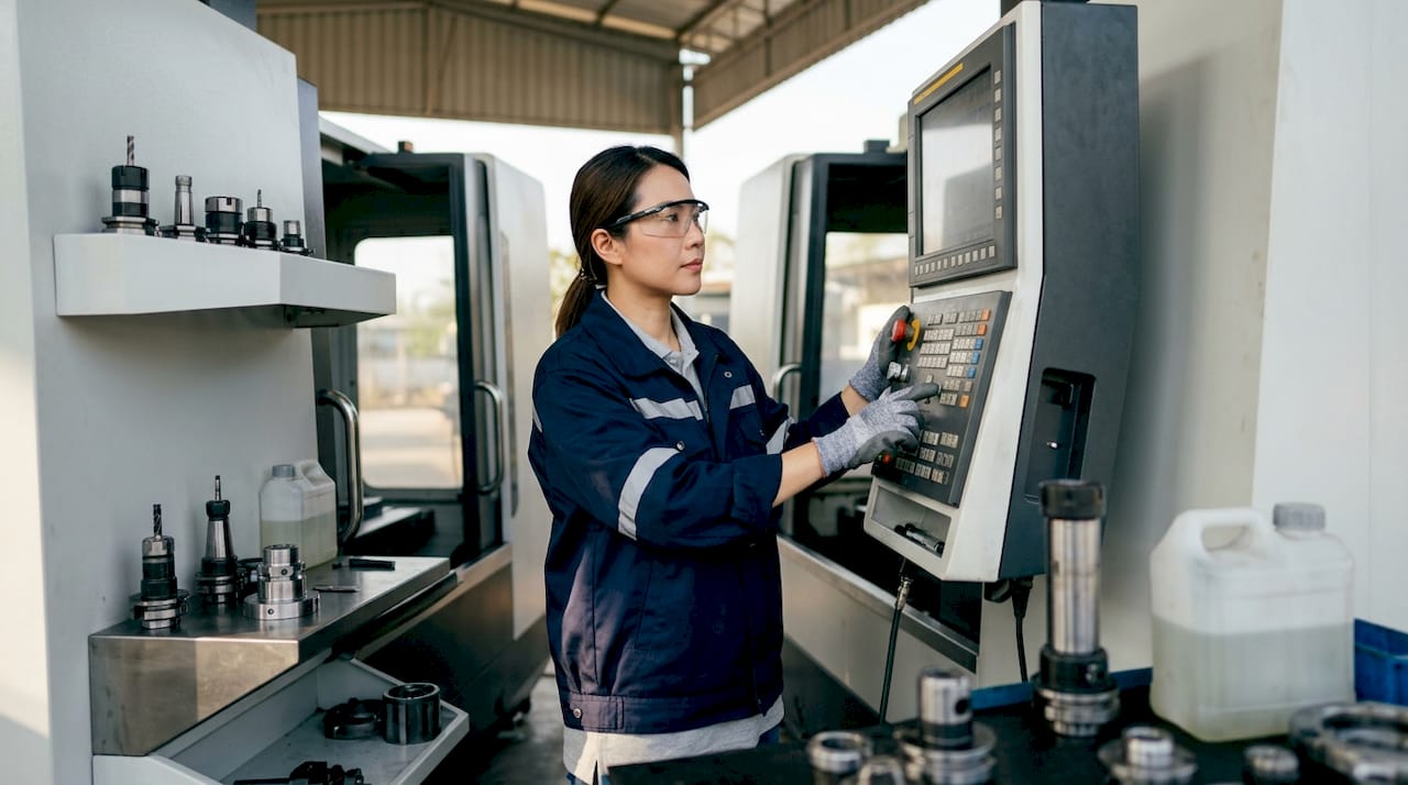 Engineer Operating CNC Machining Center Controls Engineer operating CNC machining center controls