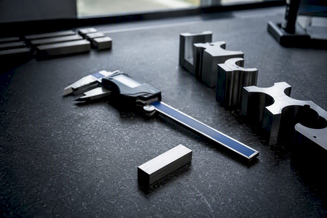 Machined Parts And Gauges At Inspection Bench Machined parts and gauges at inspection bench