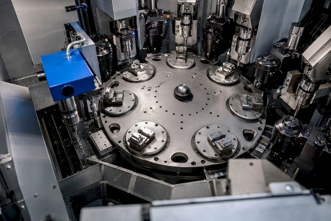 Rotary transfer machining stations around indexing table